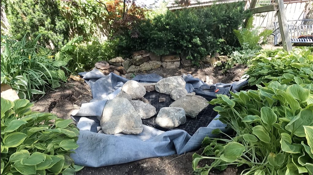 Hand-building the pondless waterfall during construction